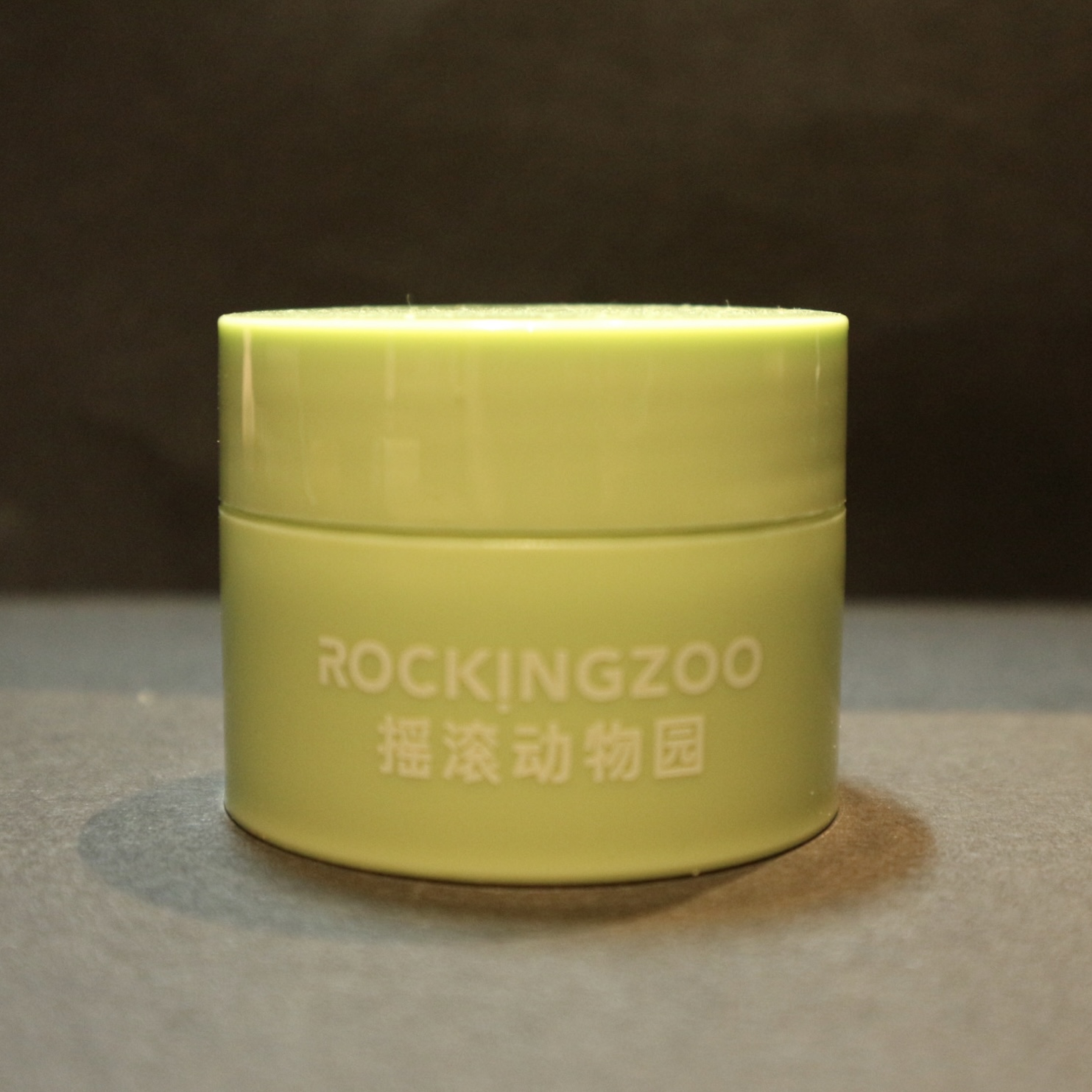 front side of a green makeup remover balm