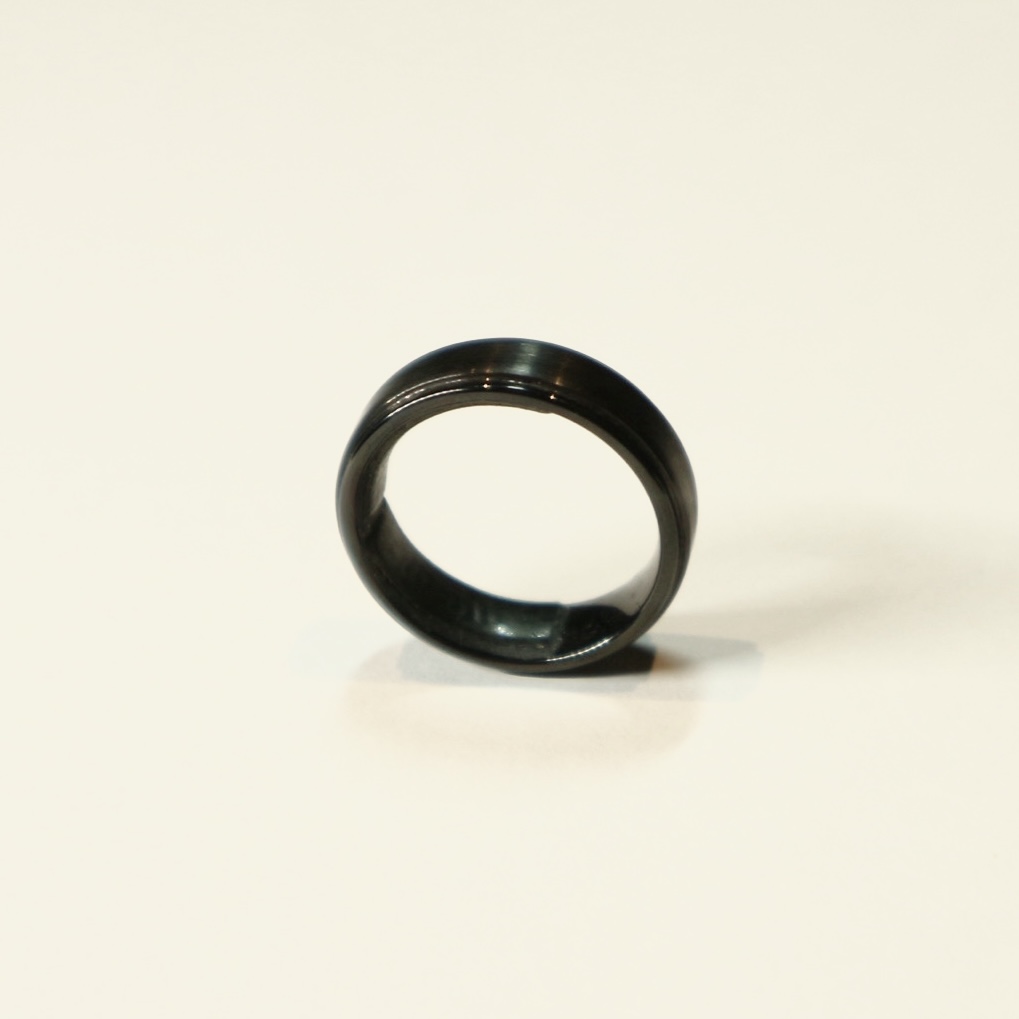 side view of a black standing ring